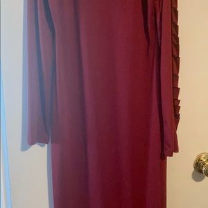 Red dress the sleeve are cut and a cut on the leg